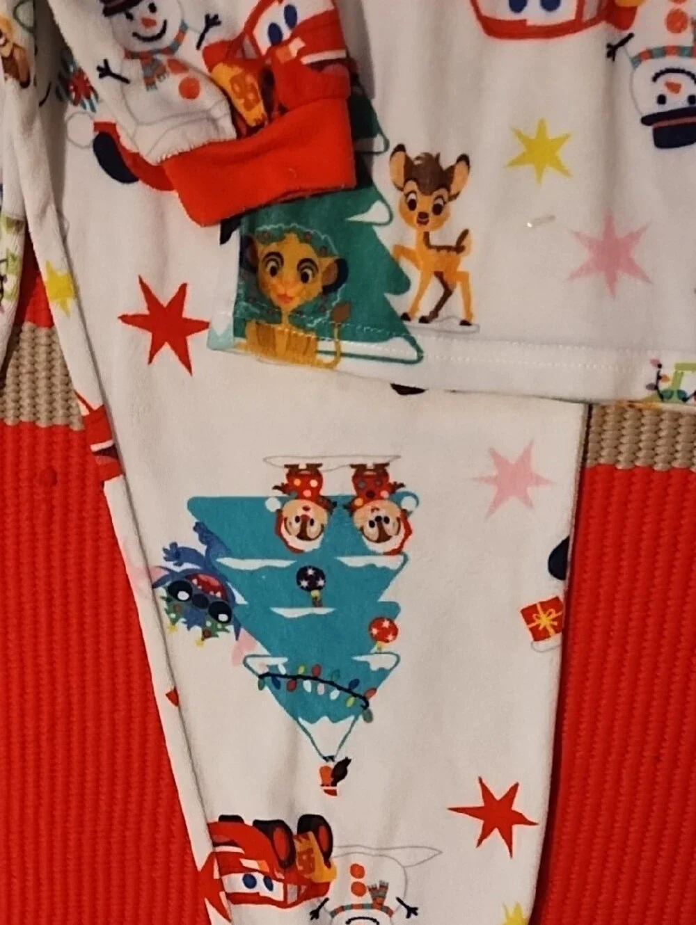 Disney Kids Holiday Pajama Set - White with Red Accents and Multicolor Prints.